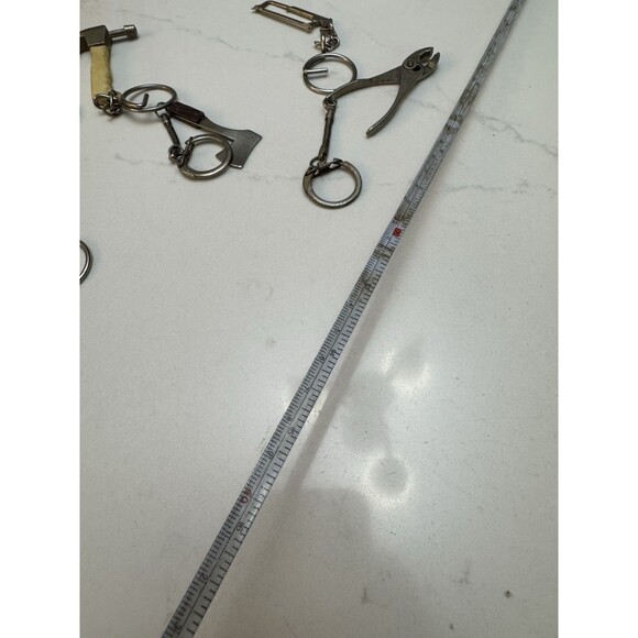 6 VTG Tool Keychain Lot – Hammer Axe Saw Pliers Tape Measure Handyman Metal Trin - Picture 7 of 8